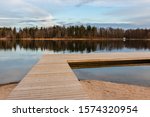 A Wooden Footbridge On The Lake ...