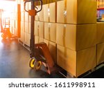 Small photo of Hand pallet truck with stack package boxes on pallet, cargo delivery export shipment goods
