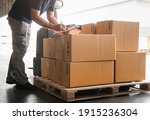 Warehouse Workers Holding Clipboard his Doing Inventory Management Packaging Boxes. Shipping Cargo Goods Boxes Checking Stock. Shipment Boxes. Warehousing Storage.	