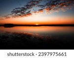 Small photo of These photos depict sunrise and sunset over the marsh and water in Lowcountry Charleston South Carolina. The exact location is Buck Hall Recreational center and Boat Ramp