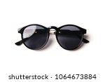 Stylish black sunglasses isolated on white background, top view