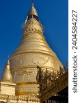 Small photo of Myanmar Sagaing Swan Oo Ponnya Shin Golden Pagoda at top of Ponnya Shin Hill on a Sunny Day
