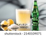 Small photo of Mineral Water with Salt and Lemon on a marble table on a soft focus background, Churchill Beverage Mineral Water Soda with Salt and Lemon