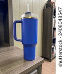 Small photo of Beautiful double walled insulated cup like a Stanley in an office setting