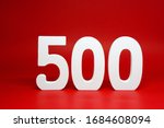 Five Hundred ( 500 ) white wooden number Isolated Red Background with Copy Space - New promotion 500% Percentage  Business finance Concept