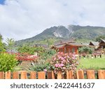 Small photo of creative layout of the beauty of Mount Sibayak as seen from the natural tourist attraction Pariban Berastagi hot springs, Tanah Karo, North Sumatra