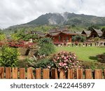 Small photo of creative layout of the beauty of Mount Sibayak as seen from the natural tourist attraction Pariban Berastagi hot springs, Tanah Karo, North Sumatra