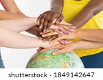 Small photo of Colorful hands. Hands on the globe. Different races of people. One team called humanity. Racial tolerance. Joint action and existence.