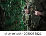 Portrait of a woman in military uniform. Equipping the Polish Army with multipurpose groups.