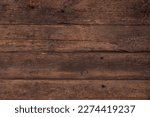 Small photo of Background of old brown boards with visible grain and damage.