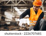 Man Cutting Steel At The Factory