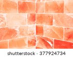 Close-up of orange salty wall inside sauna room as healty and energy concept