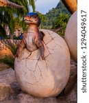 Small photo of PATTAYA, THAILAND - JANUARY 2, 2019: Baby Compsognathus on Dinosaur Valley in Nong Nooch Tropical Botanical Garden.