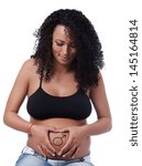 Small photo of The tummy of a woman far gone with child, having the Mars sign playfully drown around the navel, hands forming a heart shape around it.