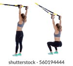 Athletic woman performing a functional exercise with suspension cable.