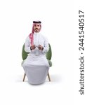 Saudi man sitting on chair and...