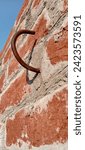 Small photo of eyelet metal hook concrete rusted old wrought iron hook on wall rustic nail hook