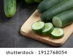 Fresh Cucumbers Sliced On Dark...