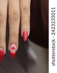 Small photo of Heart on Nail Deign with red nail Polish