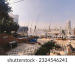 Small photo of Cairo, Egypt - December 27 2020: A view for Cairo skyline from Scarabee Nile cruise and boat dock called Ali Baba port showing different buildings that make skyline of Egypt on the river Nile banks.