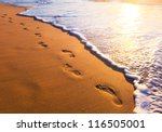 Beach  Wave And Footsteps At...