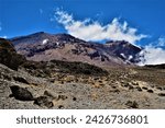 Small photo of Kibo volcanic cone with Uhuru Peak (5895 m) on its rim as seen from the part of hiking trail (Machame or "Whiskey" route) leading from Shira Camp to Barranco Camp (Kilimanjaro National Park, Tanzania)