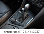 Small photo of Automatic gear stick of a modern car. Car interior details. Transmission shift. Close-up details of automatic transmission and gear stick. Automatic gear lever and gear shift.