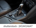 Small photo of Automatic gear stick of a modern car. Transmission shift. Close-up details of automatic transmission and gear stick. Automatic gear lever and gear shift. Car interior details.