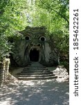 Small photo of Bomarzo, Viterbo, Lazio / Italy - 08/25/2020: Orcus mouth sculpture at famous Parco dei Mostri (Park of the Monsters), also named Sacro Bosco (Sacred Grove) or Gardens of Bomarzo in Bomarzo