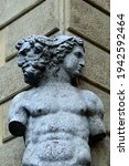 Small photo of Reggio Emilia, Emilia Romagna, Italy - 03.01.2021: The two-faced statue of Janus on the corner of Palazzo Magnani