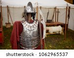 Small photo of Metal hussar armour of seventeenth century and poleaxe.