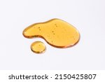 Liquid cosmetic gel or serum texture smudge yellow