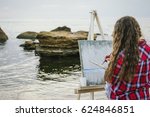 Female Artist Painting A Sea...