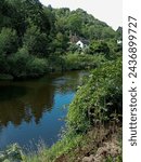 Small photo of Ironbridge river Severn Shropshire England Telford. river surrounded with trees and bushes and old historian house