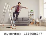 Small photo of Unlucky young man has slipped from ladder while doing repairs and renovating house and is falling down on floor. Concept of getting hurt and injured in dangerous domestic accidents at home
