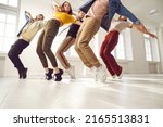 Small photo of Group of young hip hop dancers rehearse together and learn new choreography in dance studio. Talented young people in casual clothes who are standing on their toes same time. Concept of modern dance