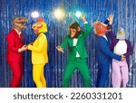 Small photo of People in different animal disguises having fun at costume party. Group of happy people in bright suits and funny silly dinosaur, bird, ape, horse and dove masks dancing on blue foil fringe background