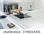 Metal Pot and frying pan on induction hob in modern kitchen. modern kitchen pot cooking induction electrical stove hob concept