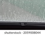 Small photo of Closed sunshade. Car side window curtains sunshades. Sunblind curtain in a modern car.