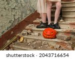 Small photo of A festive pumpkin with a ghastly face participates in traditional and ritual during Halloween.