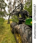 Small photo of Kalety, Poland, August 4, 2023: Forestry harvester during a stoppage among trees in the fores.