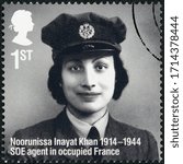 Small photo of LONDON, UNITED KINGDOM - MARCH 25, 2014: A stamp printed in United Kingdom shows Noorunissa Inayat Khan (1914-1944), Remarkable Lives, 100th Birth Anniversaries, 2014