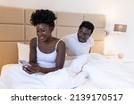 Small photo of Tired frustrated African woman ignores angry black despot husband who quarrels blames upset woman for problems, jealous man blames sad girl, family quarrel and controls boyfriend, disrespect