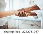 Small photo of Friendly male doctor's hands holding female patient's hand for encouragement and empathy. Partnership, trust and medical ethics concept. Bad news lessening and support. Patient cheering and support
