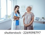 Small photo of Doctor and patient discussing something at hospital . Medicine and health care concept. Doctor and patient. Patient Having Consultation With Doctor In Office.