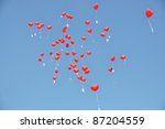 Red balloons with the messages in the blue sky