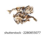 Small photo of The food waste. Remains of fried fish. Fishbone and leftover meat of mackerel after eat isolated on white background.