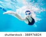 Female Swimmer Gushing Through...
