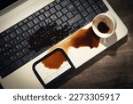 Coffee spilled over laptop keyboard.