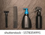 Small photo of Men's hair and beard care set on stone background. Set for care of a man's face. Flat lay.